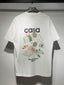Casablanca Tennis Equipment Collage Graphic White Short Sleeve T-Shirt Unisex