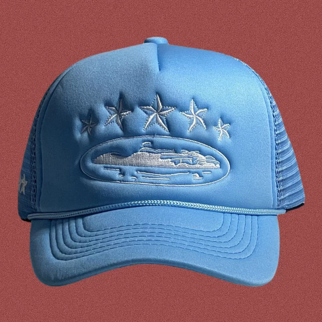 Corteiz Vintage Light Blue Trucker Hat with White Stars and Cruise Ship Graphic Hover Image