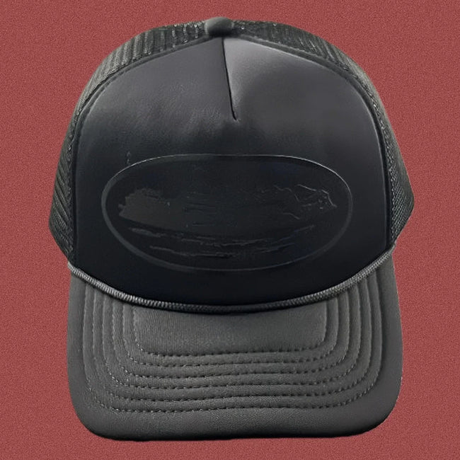 Cortiez All-Black Monochromatic Oval Ship Logo Trucker Hat Hover Image